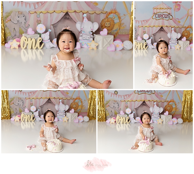 Girly circus themed cake smash with girl smiling and cake on face